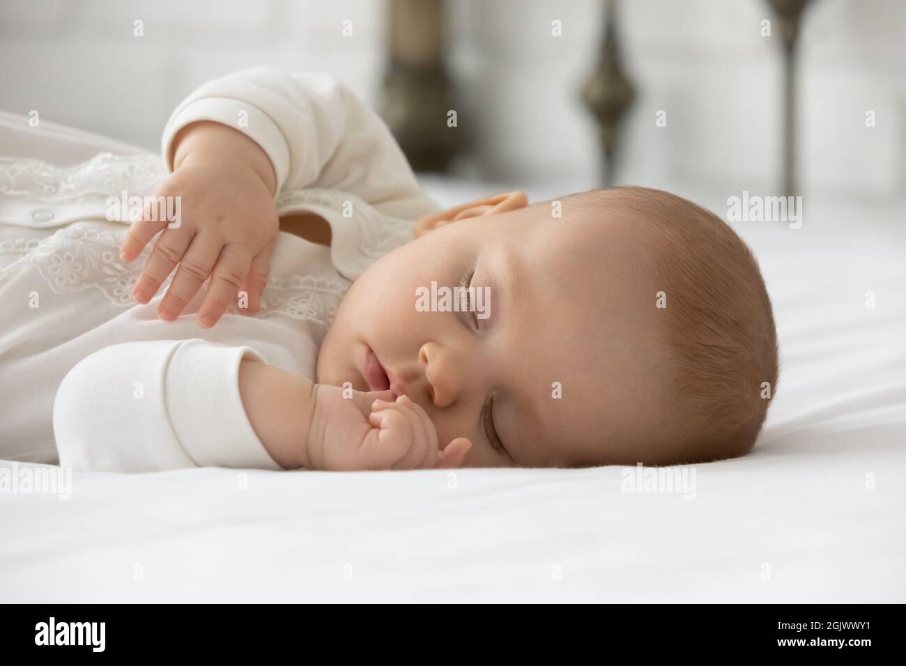 Calm few month nappy baby sleeping on bed Stock Photo Alamy