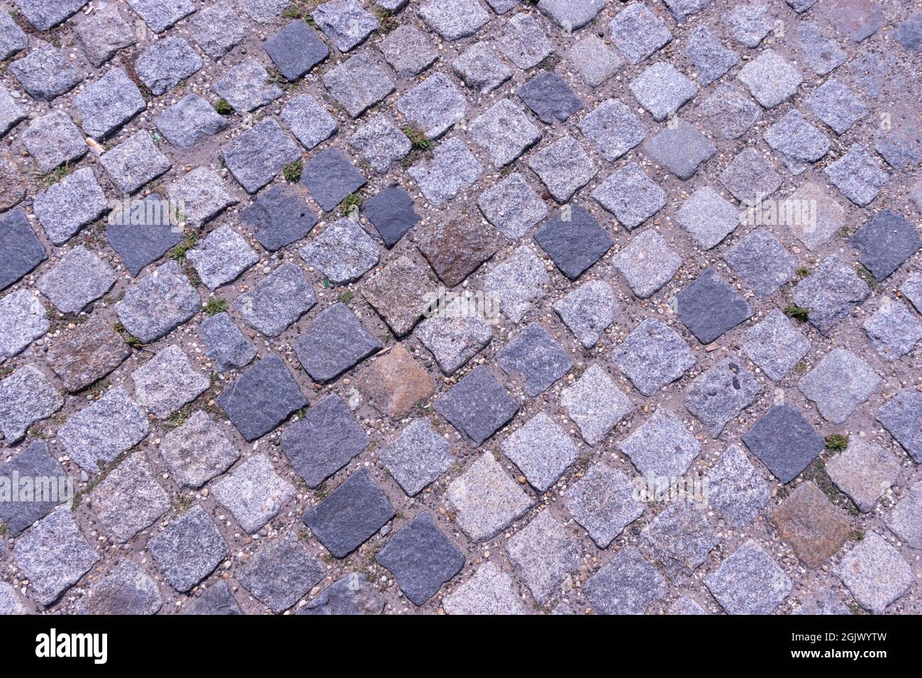 Old cobblestone pavement close-up background and texture Stock Photo