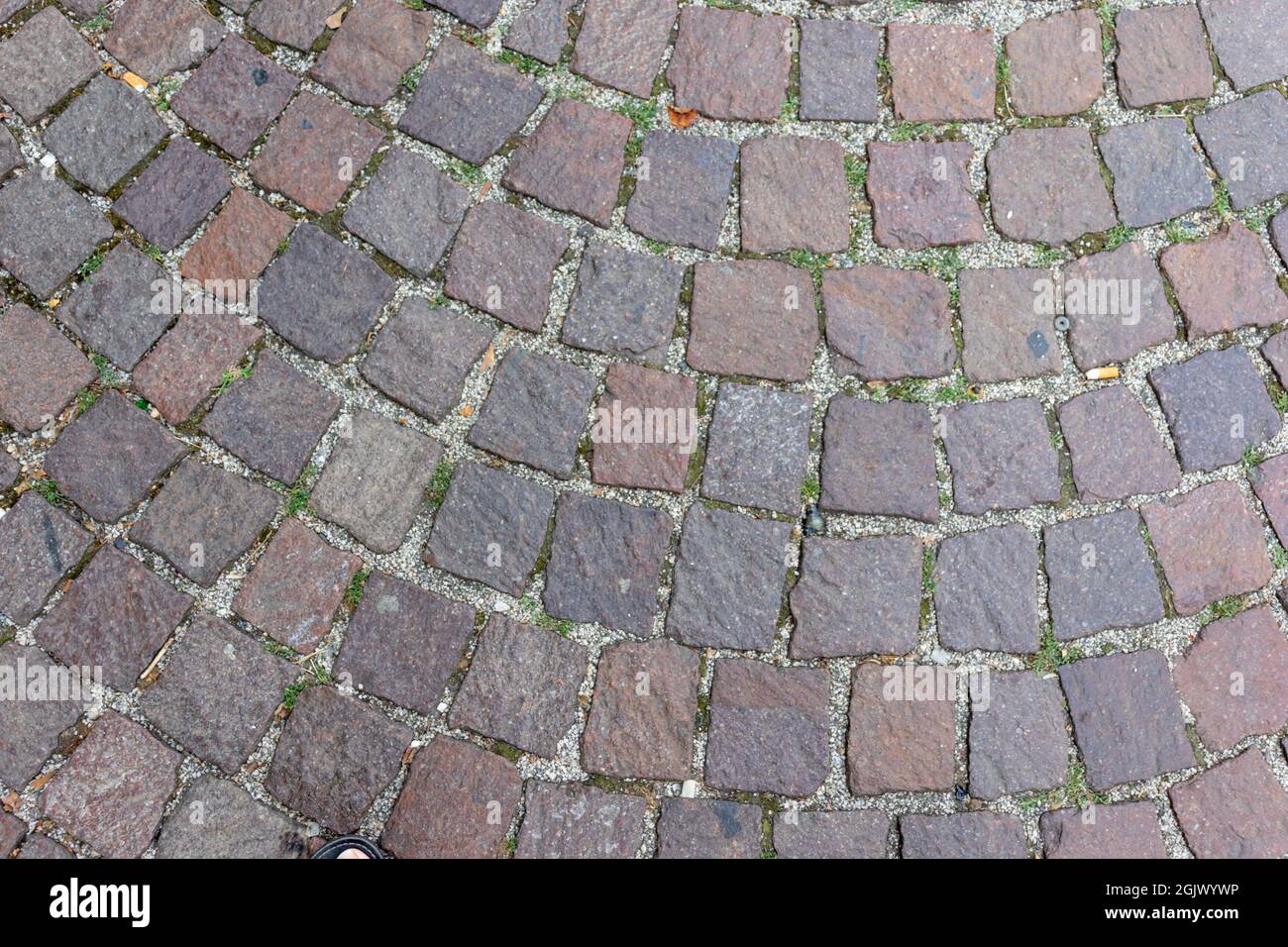 Old cobblestone pavement close-up background and texture Stock Photo
