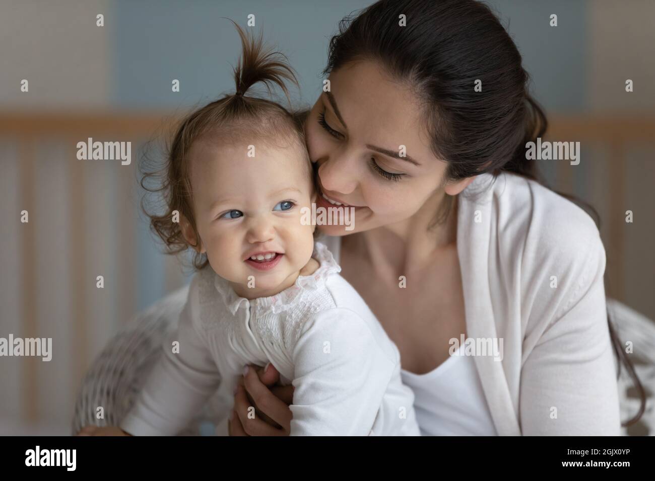 Mum cuddling toddler hi-res stock photography and images - Alamy