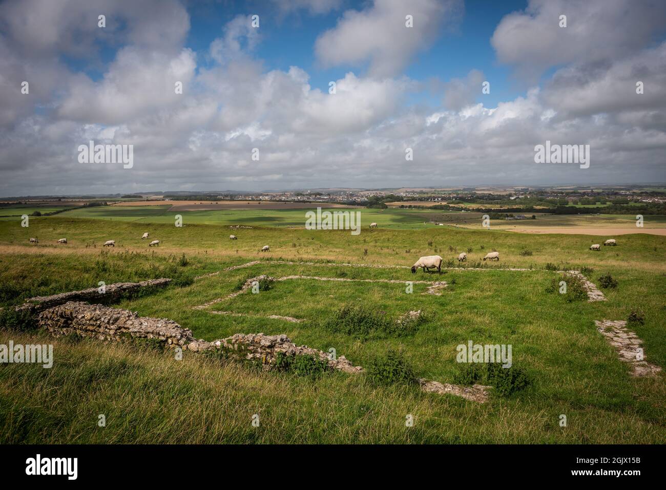 The remains of a Roman temple within Maiden Castle, the largest Iron Age hill fort in the UK Stock Photo