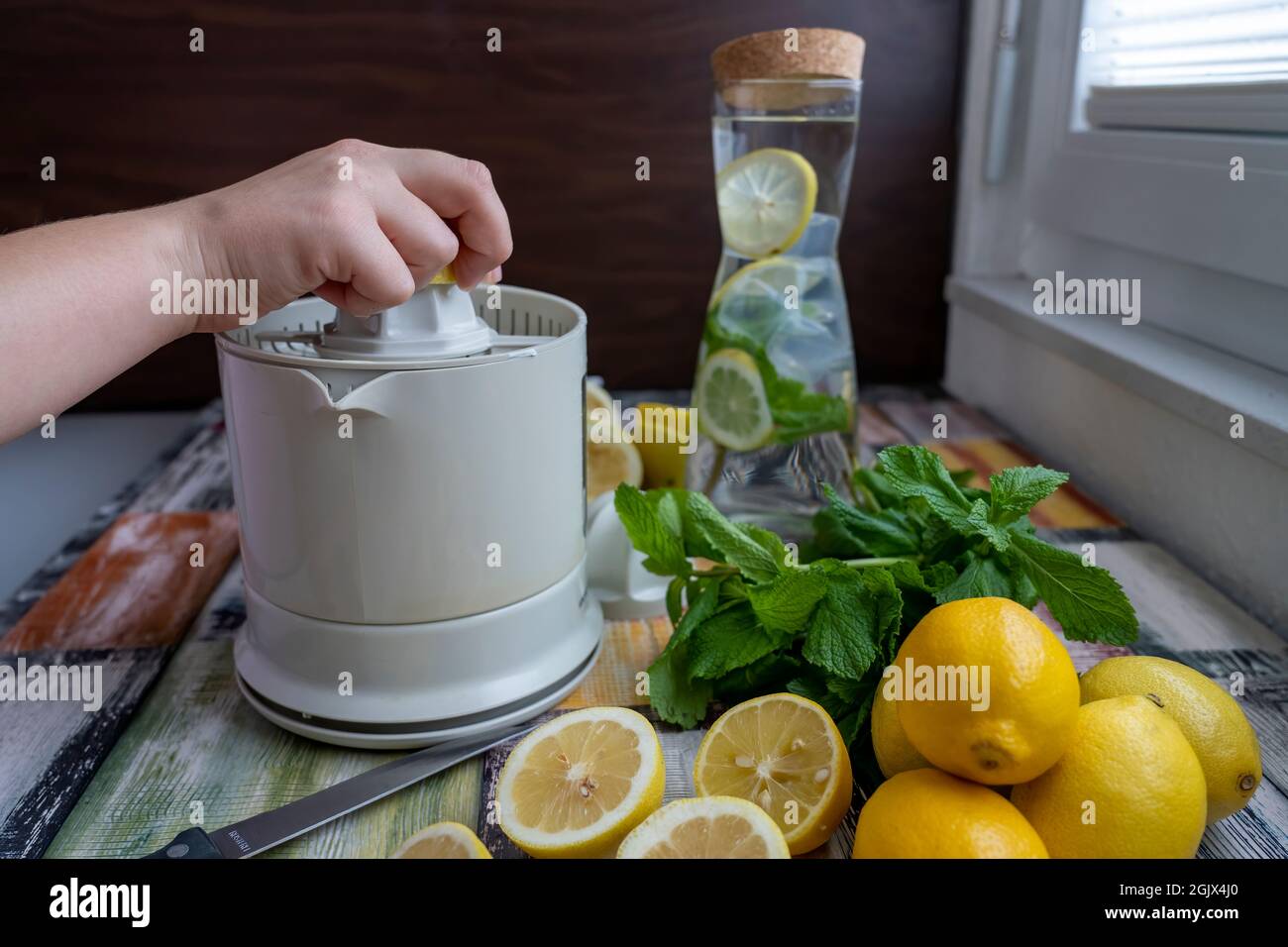 Preparation of fresh juices press on fresh lemon and lime. lemon