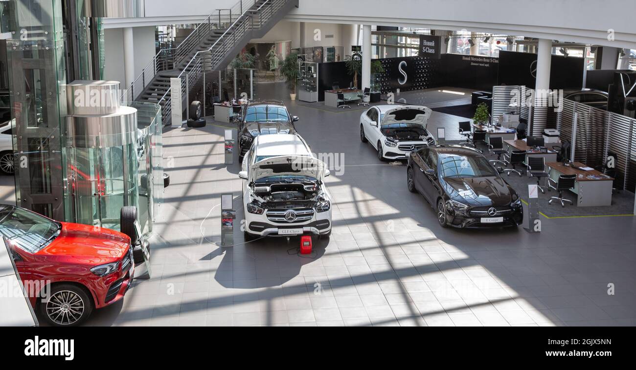 KYIV, UKRAINE - MAY 10, 2021: New cars indoors on display in Mercedes-Benz Automotive Center dealership company, view from above. Stock Photo