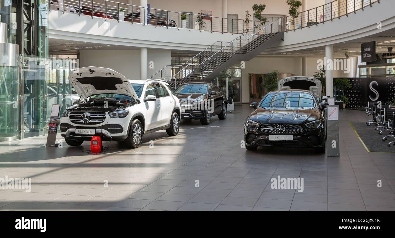 KYIV, UKRAINE - MAY 10, 2021: New cars indoors on display in Mercedes-Benz Automotive Center dealership company, view from above. Stock Photo