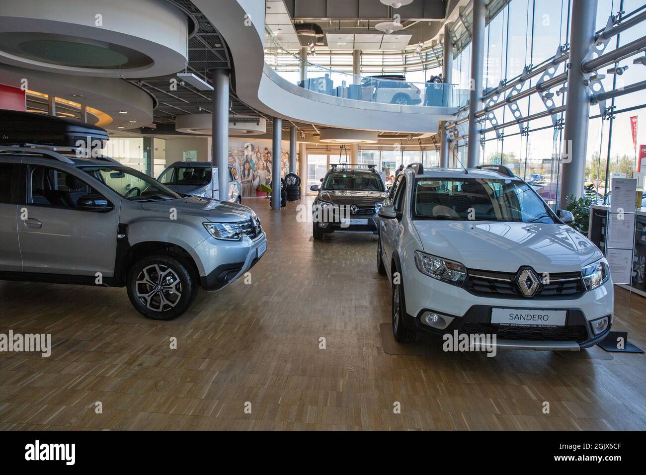 KYIV, UKRAINE - MAY 10, 2021: New Sandero cars indoors on display in Renault Center dealership company, view from above. Renault Group is a French mul Stock Photo