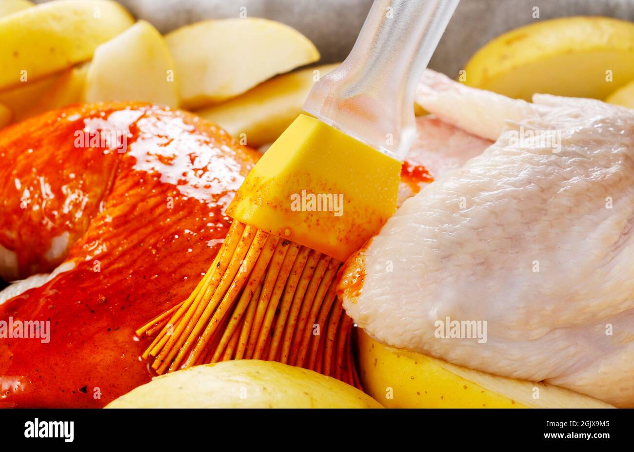 Preparing poultry for baking. Marinated meat. Party dish Stock Photo Alamy