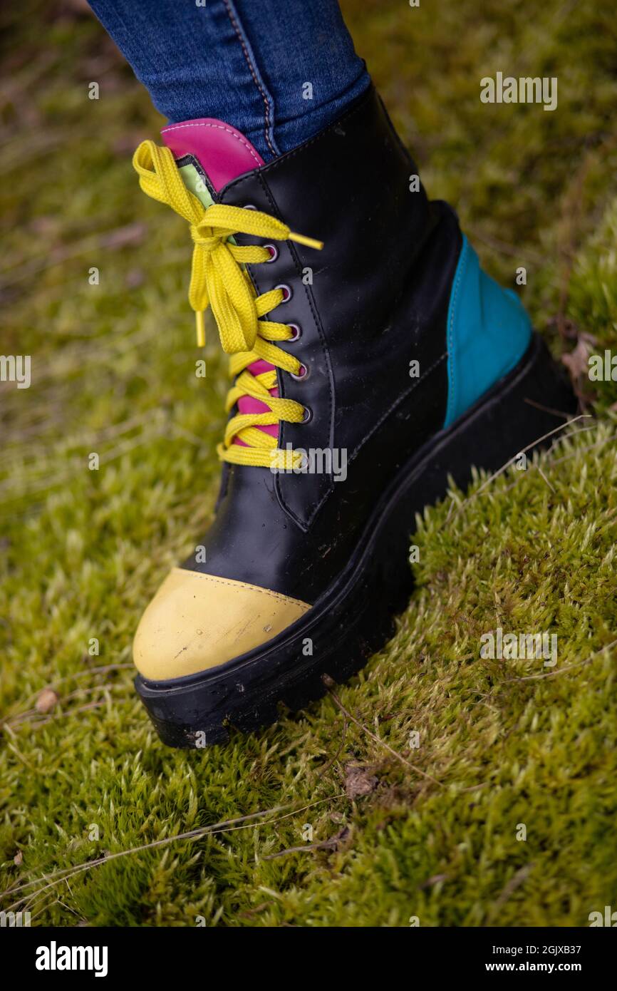 Close-up of colorful leather winter boots. Women fashion Stock Photo