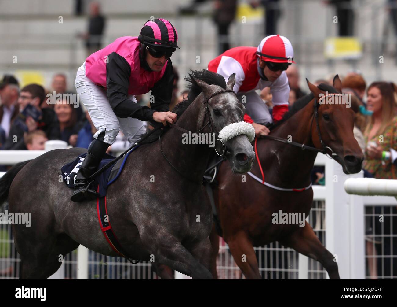 Michael Hussey riding Big Gossey (left) on their way to winning the Irish Stallion Farms EBF 'Bold Lad' Sprint Handicap during day two of the Longines Irish Champions Weekend at Curragh racecourse. Picture date: Sunday September 12, 2021. Stock Photo