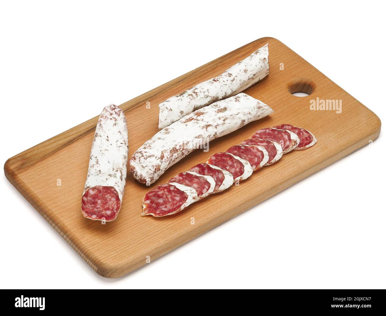Traditional Spanish Fuet thin dried sausage with slices, Close-up, isolated on a white background Stock Photo