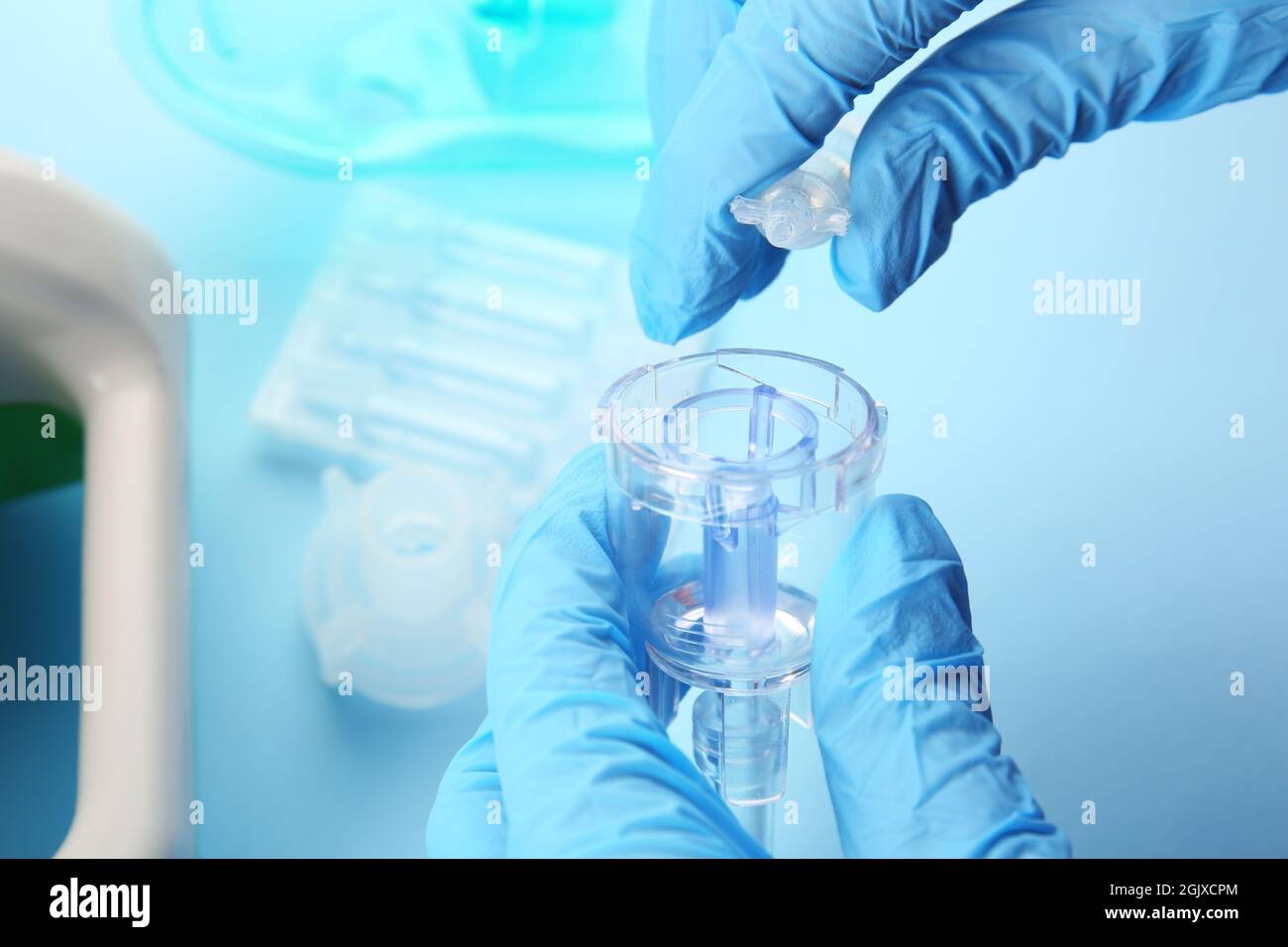 Doctor filling medication cup with remedy for inhalation therapy Stock