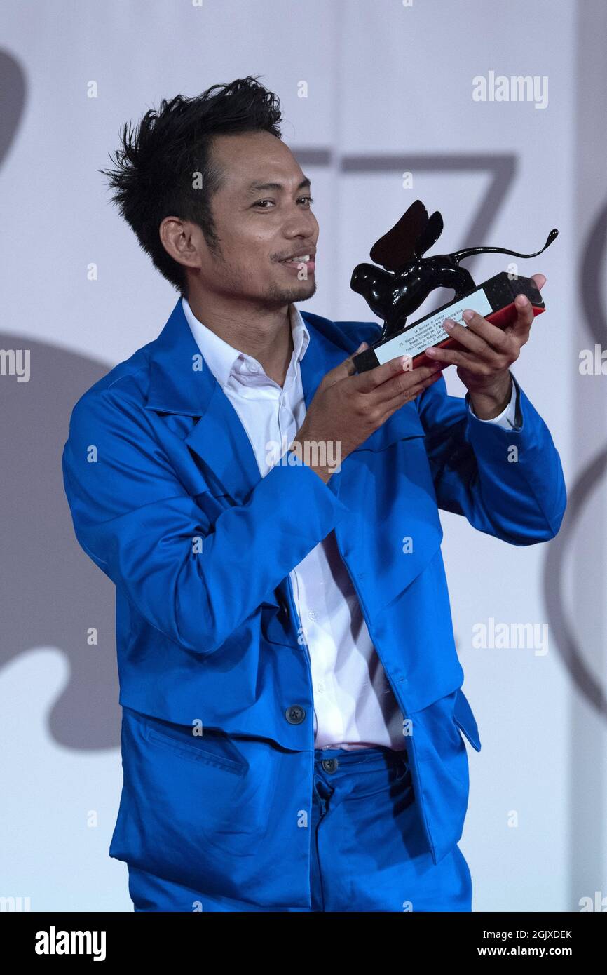 Director Neang Kavich receives the Best Actor Orizzonti Award on behalf of Piseth Chhun for 'White Building' during the Winners Red Carpet as part of the 78th Venice International Film Festival in Venice, Italy on September 11, 2021. Photo by Paolo Cotello/imageSPACE/Sipa USA Stock Photo