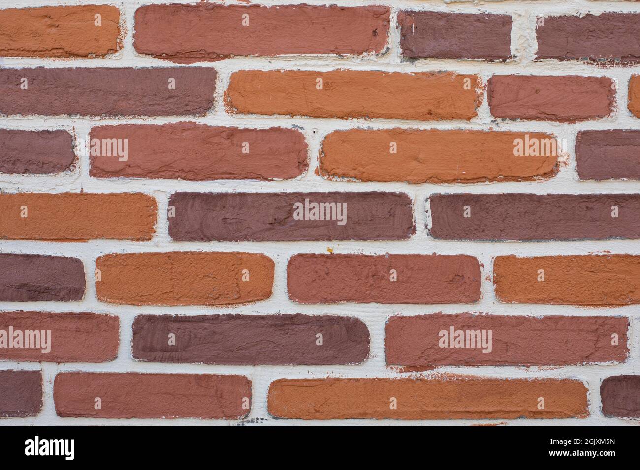 Rough old porous bricks with white grout. Texture surface wall background Stock Photo