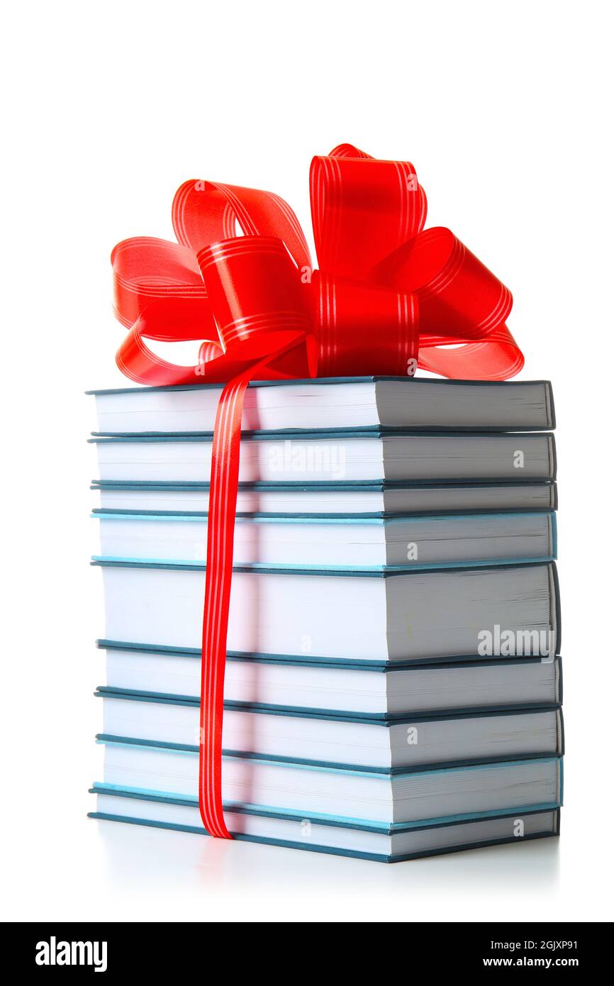 Stack of books with ribbon as gift on white background Stock Photo - Alamy