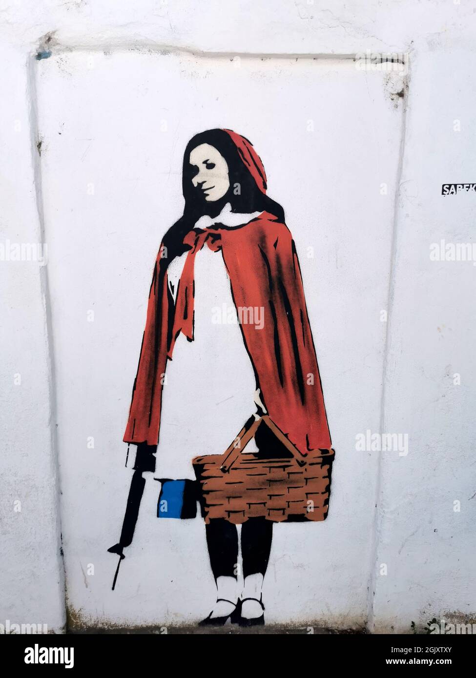 Little Red Riding Hood with gun Graffiti Porto Portugal Stock Photo