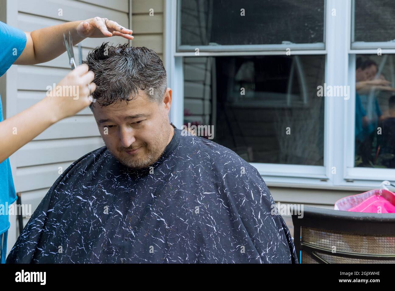 A man is around in home haircut styling in men Stock Photo - Alamy