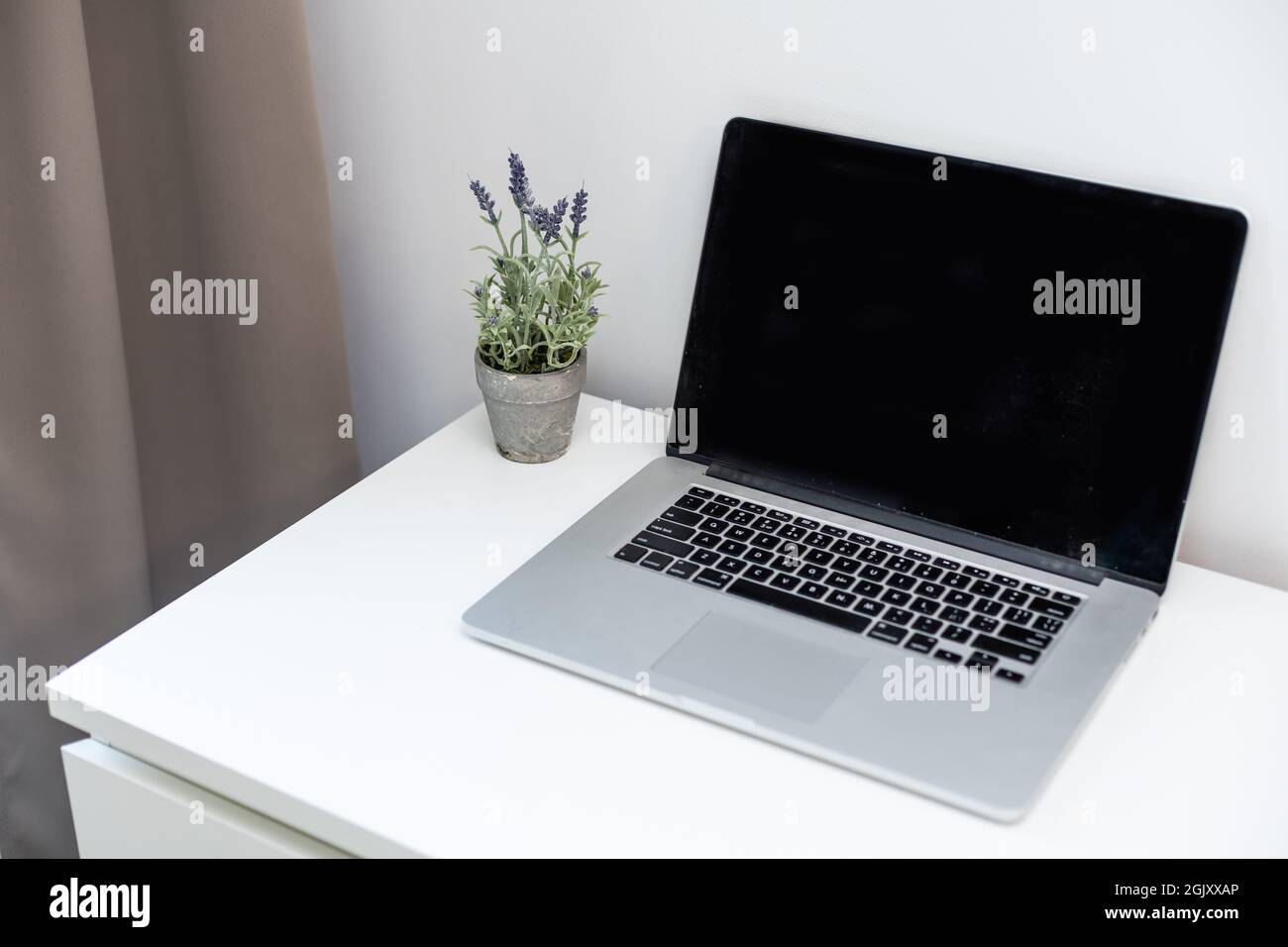laptop computer white blank screen on work table front view Stock Photo ...