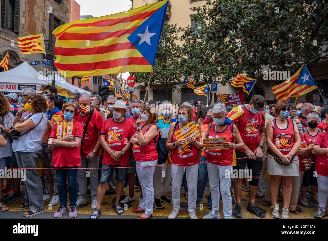 A group of protesters carrying flags and wearing pro-independence ...