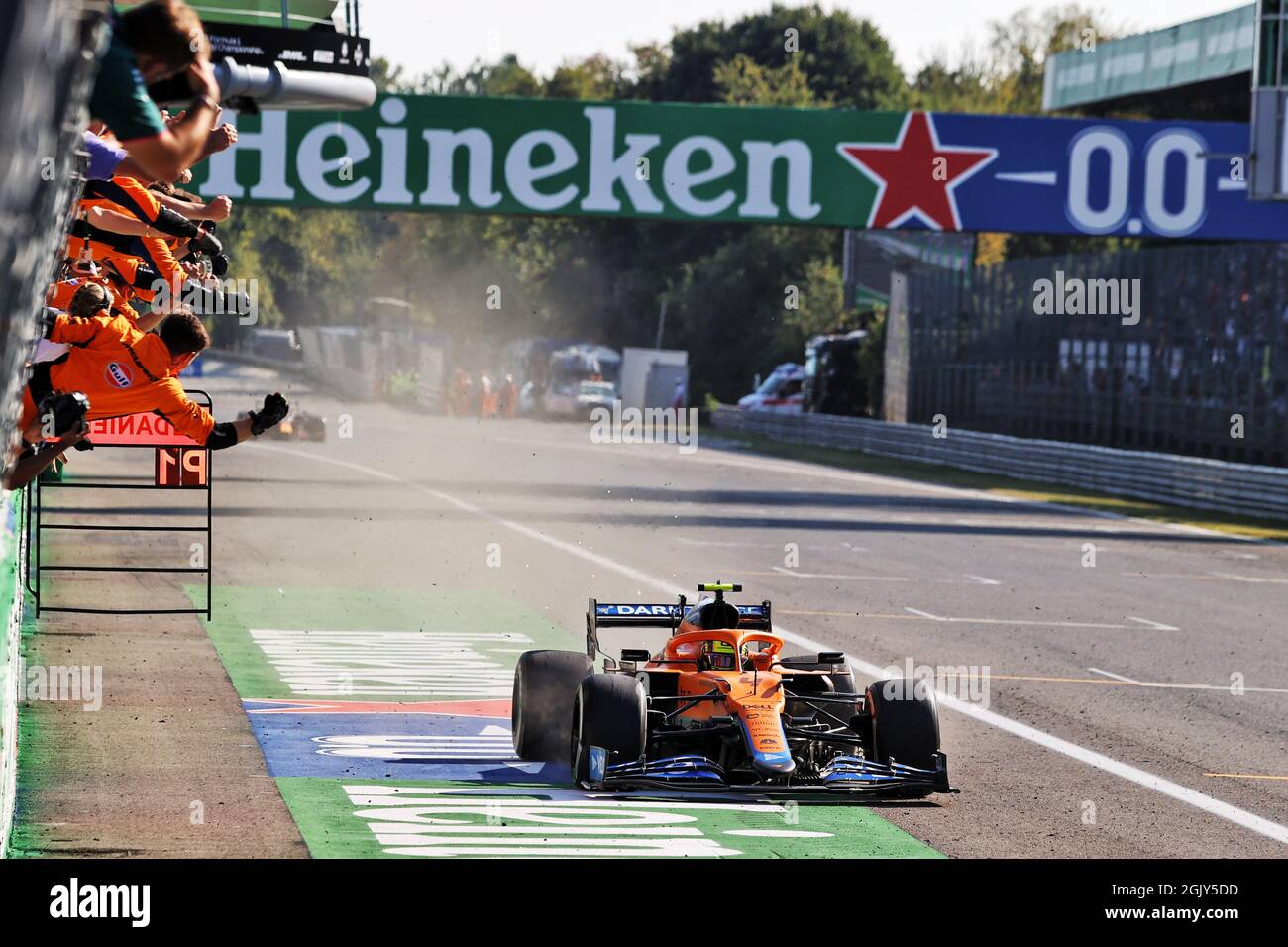 Monza, Italy. 12th Sep, 2021. Lando Norris (GBR) McLaren celebrates his second position as he passes the team at the end of the race