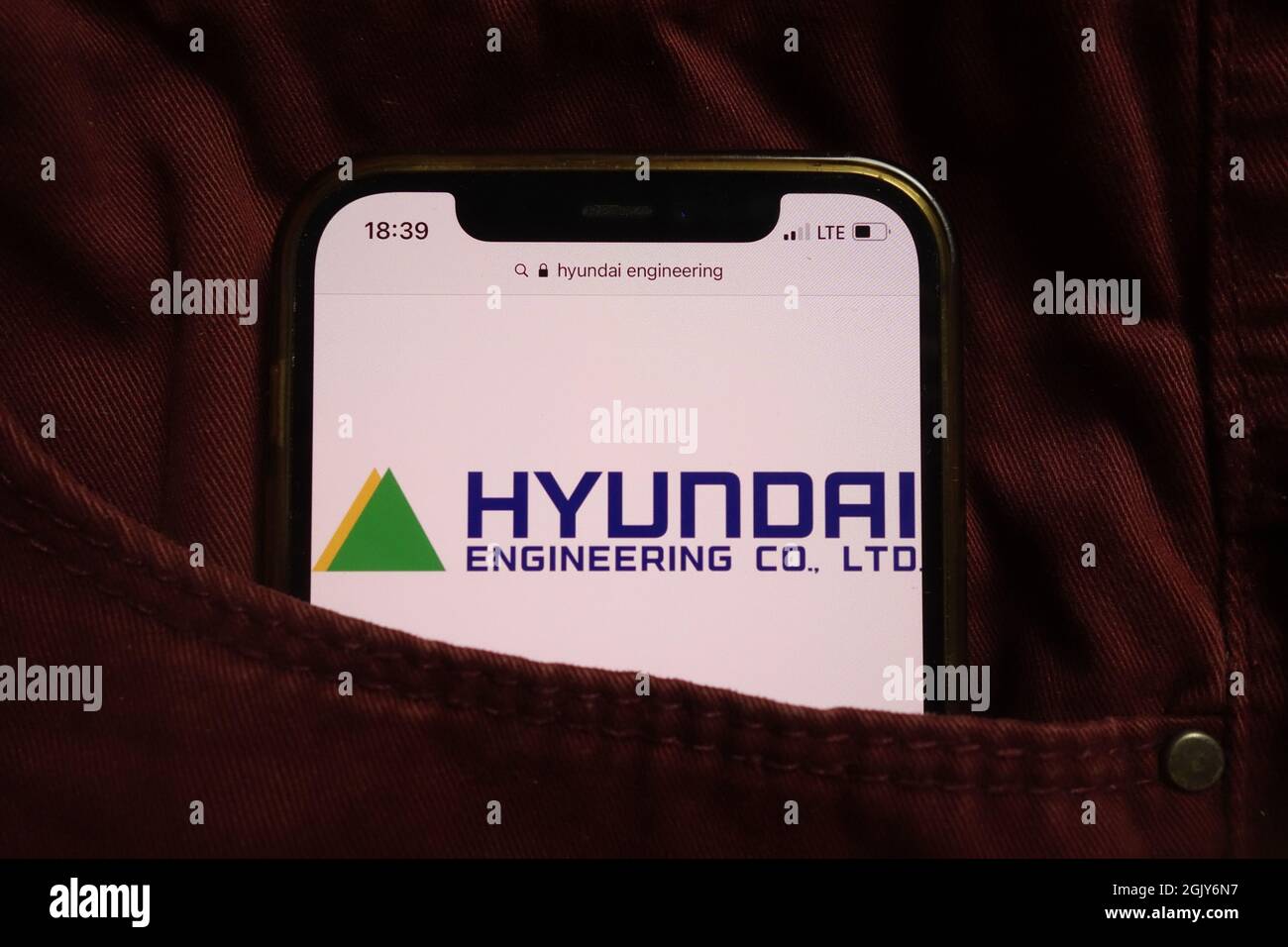 KONSKIE, POLAND - September 04, 2021: Hyundai Engineering HEC logo displayed on mobile phone hidden in jeans pocket Stock Photo