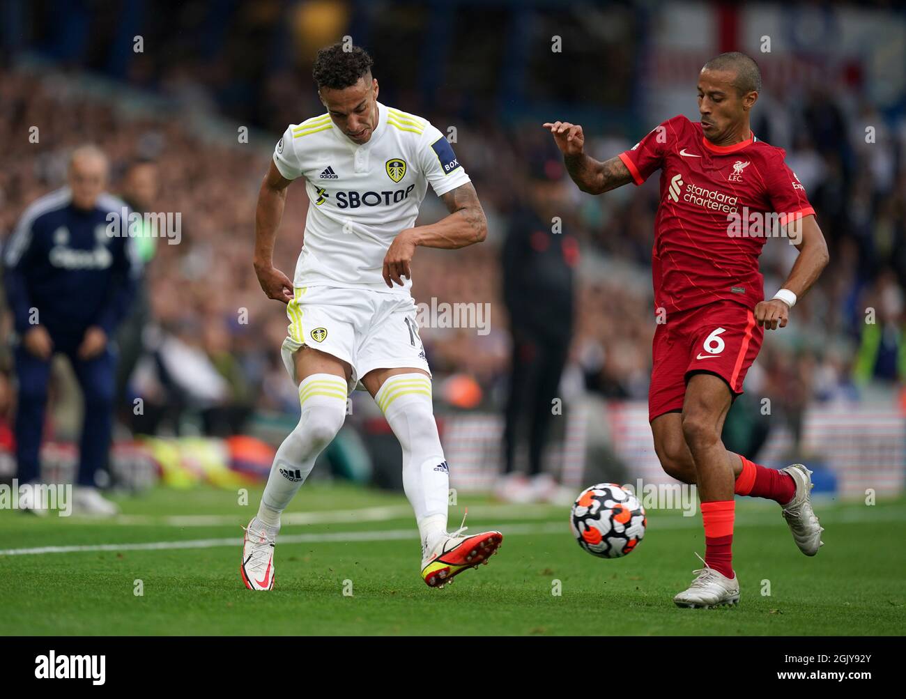 Leeds United's Rodrigo (left) and Liverpool's Thiago Alcantara battle for  the ball during the Premier League match at Elland Road, Leeds. Picture  date: Sunday September 12, 2021 Stock Photo - Alamy