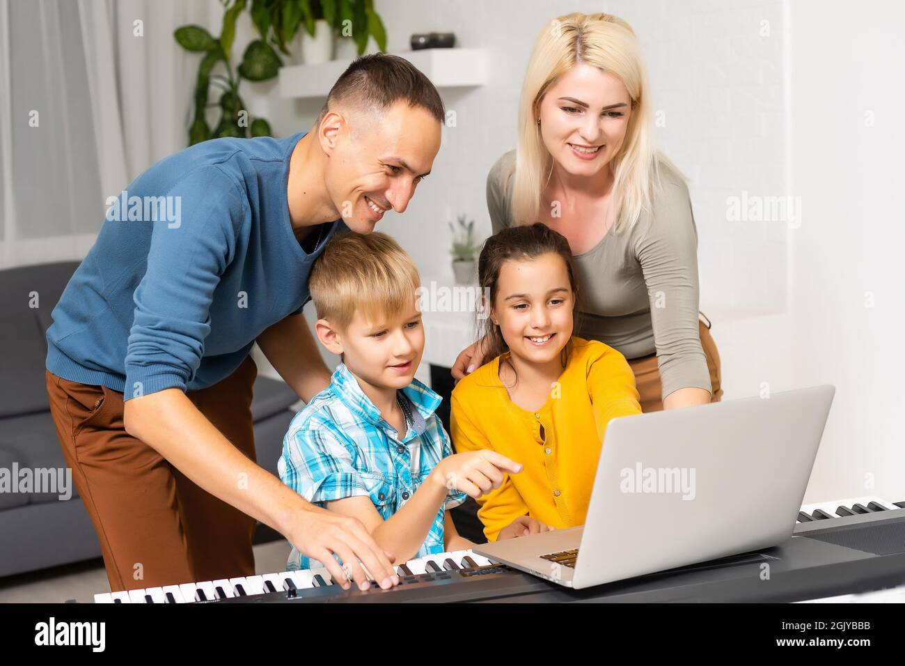 family playing synthesizer at home Stock Photo Alamy