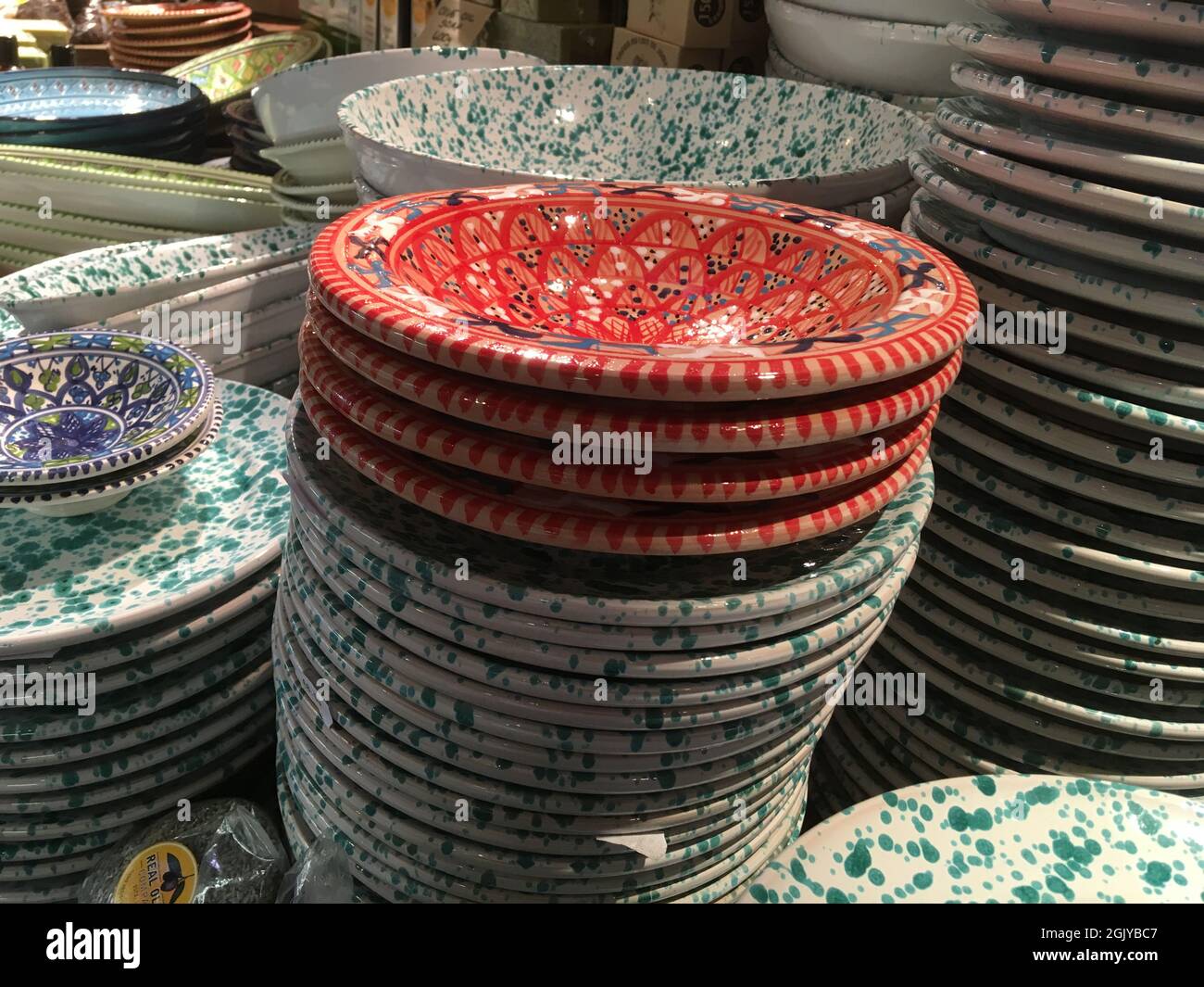 Ceramic plates stacked in market Stock Photo