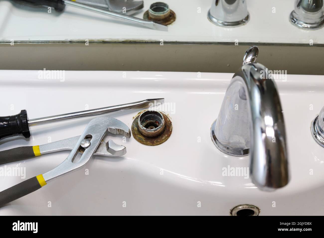 A broken bathroom sink faucet fixture Stock Photo Alamy