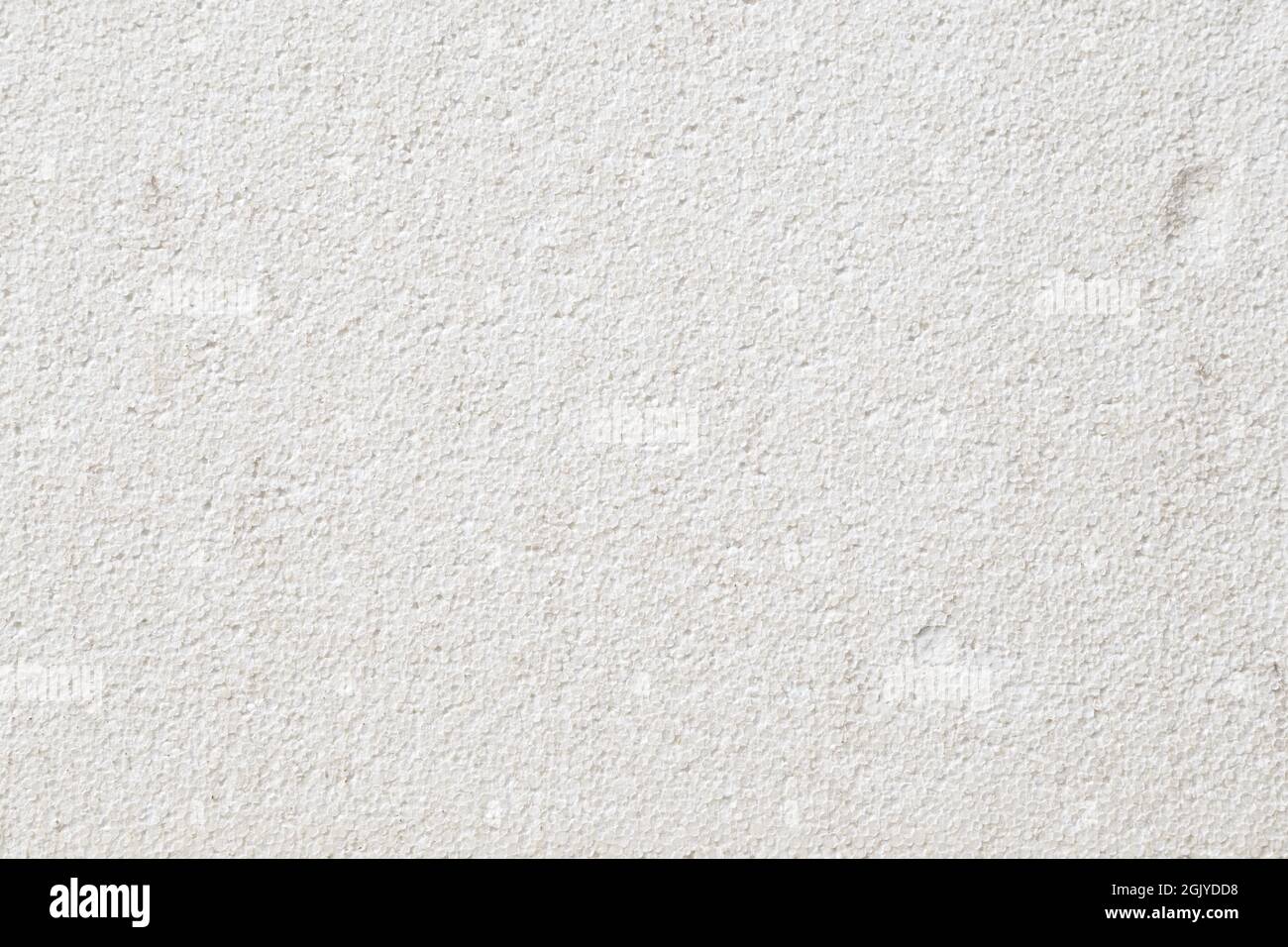 White foamed (or cellular or expanded) plastic polystyrene surface. Abstract high resolution full frame textured background. Copy space. Stock Photo