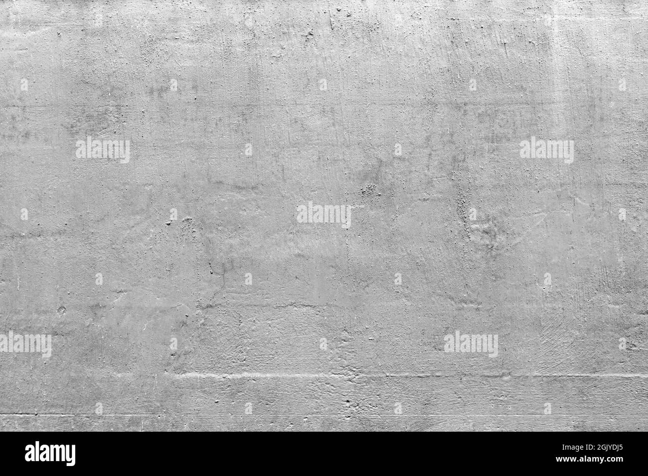Close-up of plastered and painted concrete wall. Abstract high resolution full frame textured background in black and white. Copy space. Stock Photo
