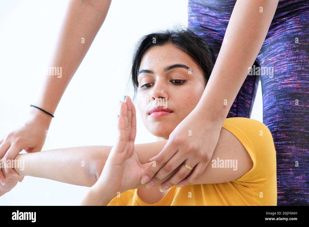 A pretty Indian woman doing stretching at home Stock Photo - Alamy
