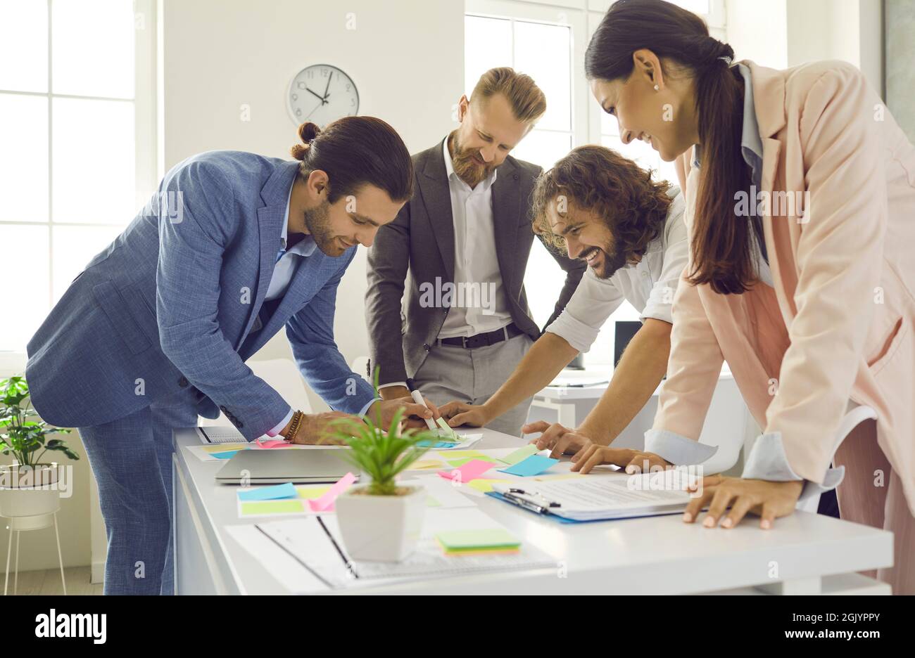 Creative team of smart expert CEOs working together to plan new business strategy. Stock Photo