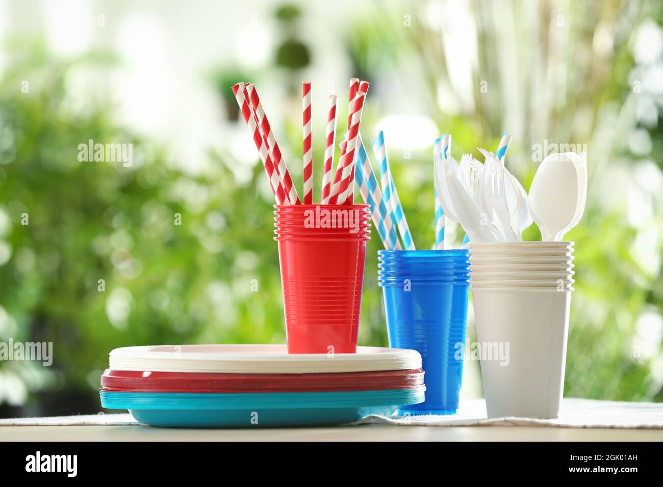 Plastic ware on table outdoors Stock Photo Alamy