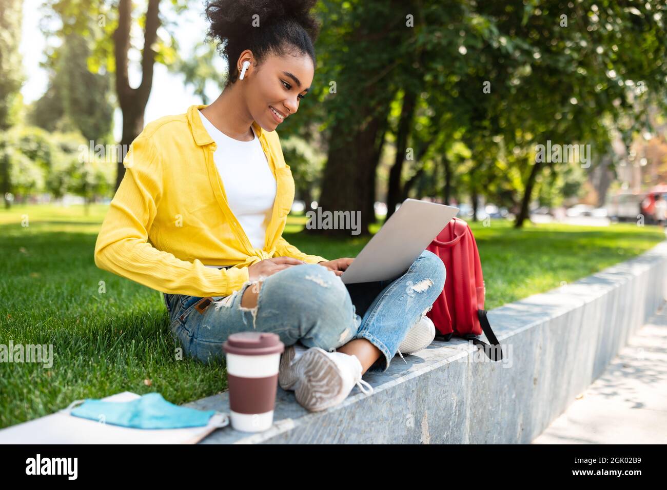 Successful African Student Girl With Laptop Computer Learning Online Outdoor Stock Photo