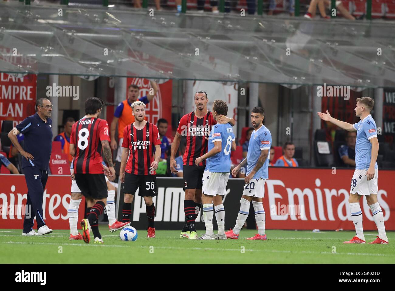 Milan, Italy, 12th September 2021. Zlatan Ibrahimovic of AC Milan clashes  with Lucas Leiva of SS Lazio following the final whistle of the Serie A  match at Giuseppe Meazza, Milan. Picture credit, image size:1300x956