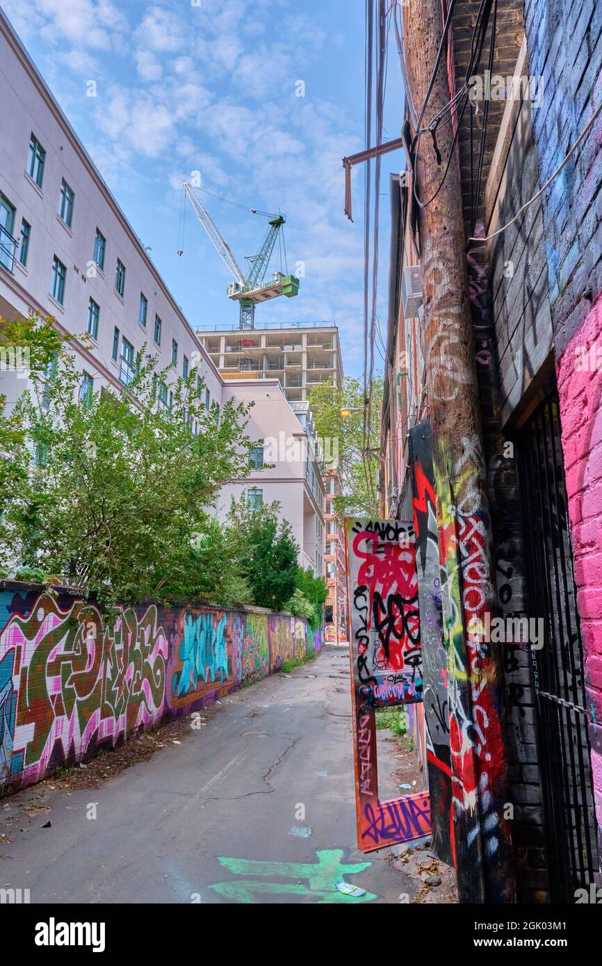 Grafitti Alley is located within the Fashion District in downtown Toronto Ontario.  Running three city blocks from Spadina Avenue south of Queen Stree Stock Photo