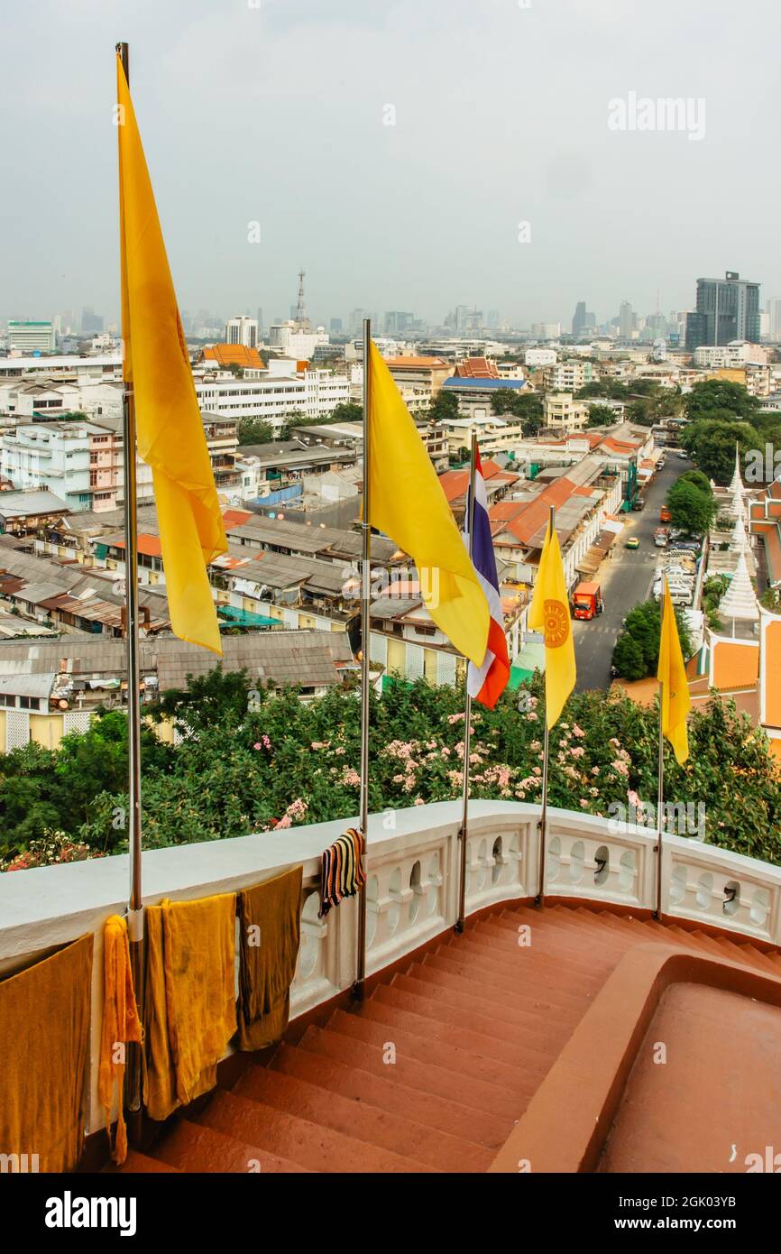 Panorama view of Bangkok from Golden Mountain on cloudy dusty day,Thailand. Traditional Thai architecture from above,modern skycrapers in background. Stock Photo