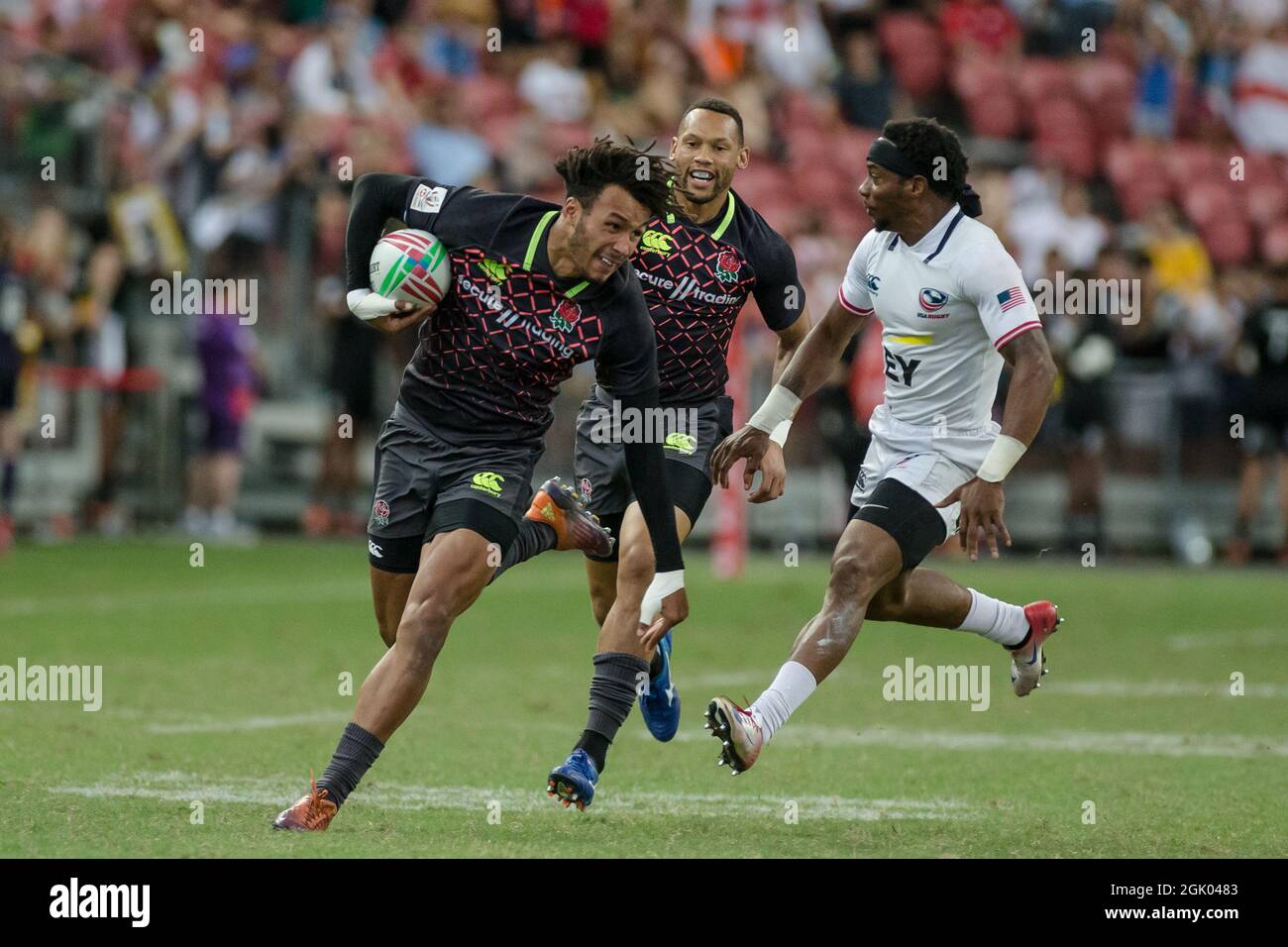 SINGAPORE-APRIL 14: England 7s Team (blue) plays against USA 7s team (white) during the Bronze medal match of HSBC World Rugby Singapore Sevens on April 14, 2019 at National Stadium in Singapore Stock Photo