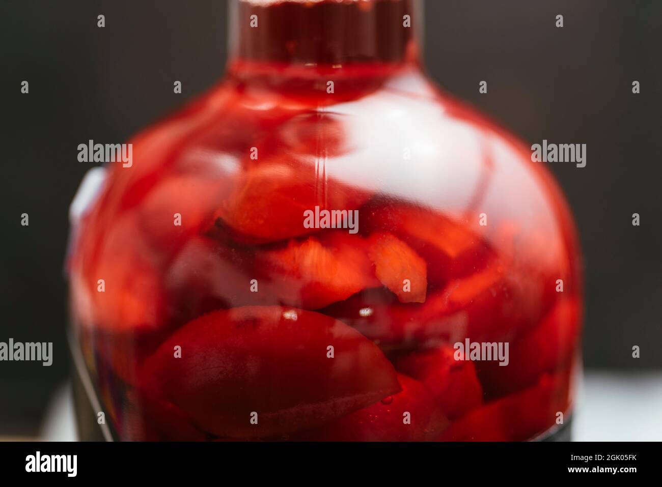 Making infused plum vinegar. Stock Photo