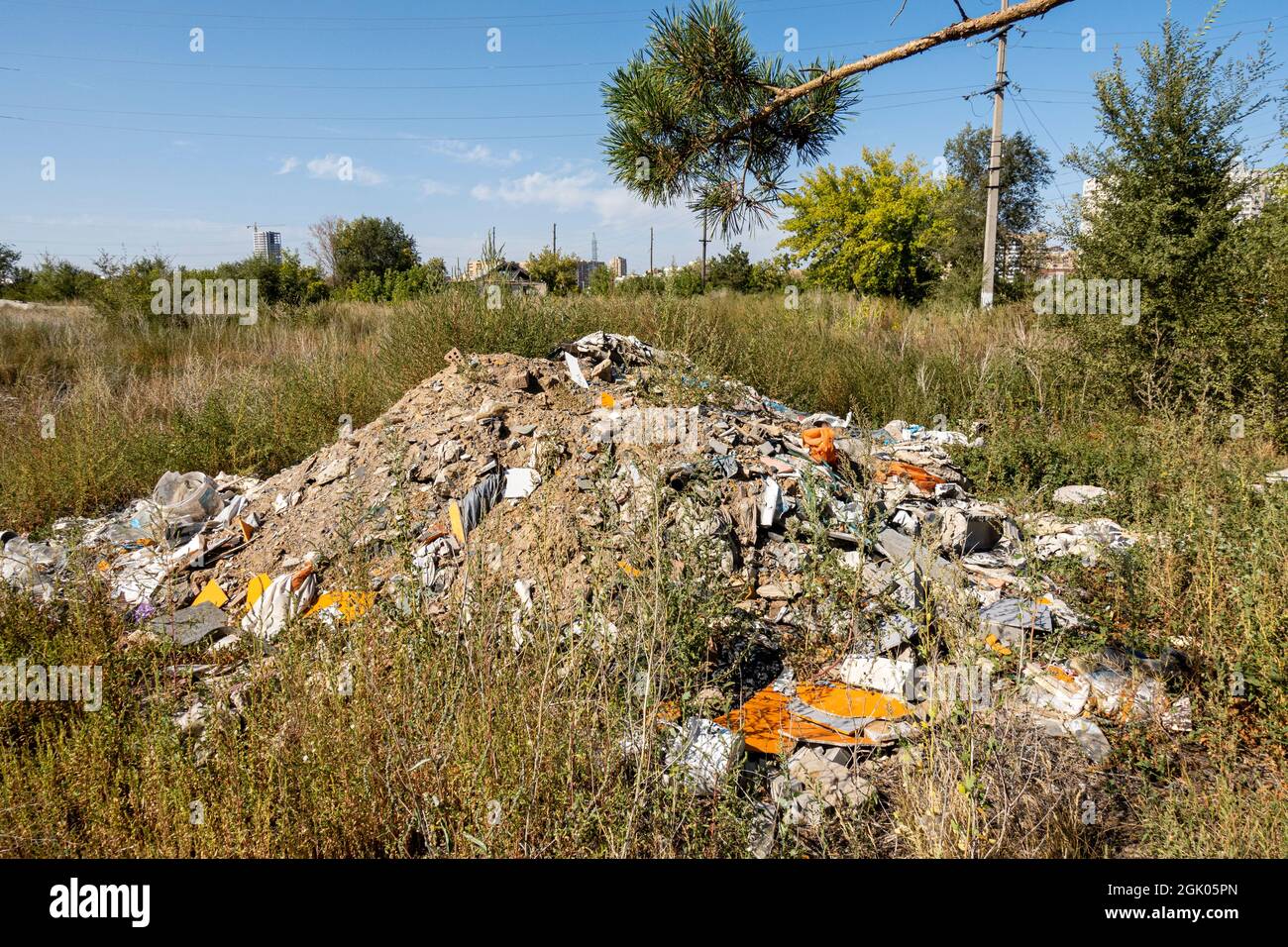 Сonstruction waste dumped in the developing area of city- concept: ecology, environment and pollution; Nur-Sultan, Kazakhstan, Central Asia Stock Photo