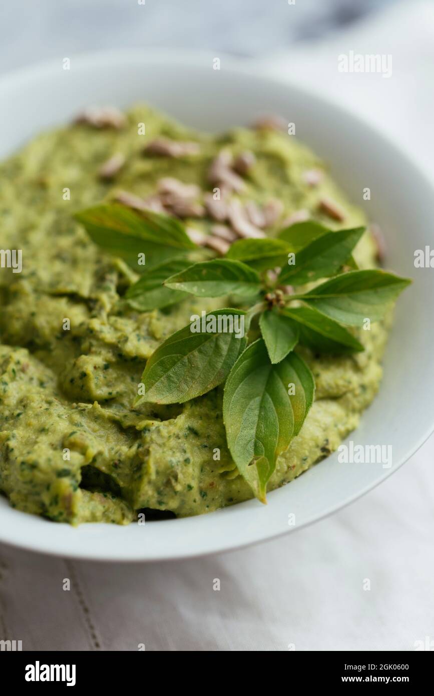 Home made basil spinach hummus Stock Photo
