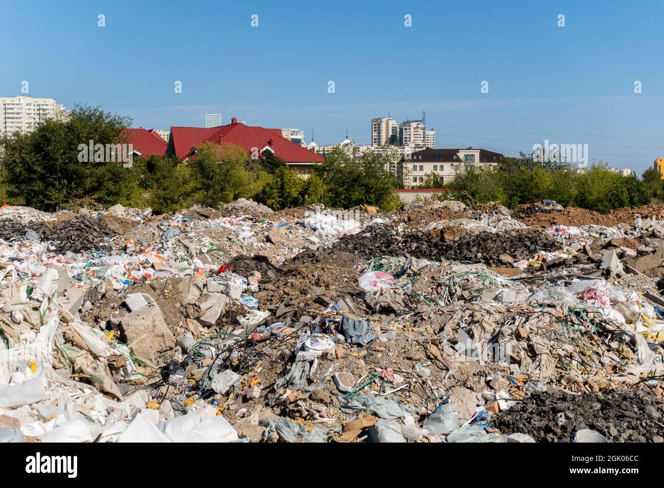 Сonstruction waste dumped in the developing area of city- concept: ecology, environment and pollution; Nur-Sultan, Kazakhstan, Central Asia Stock Photo