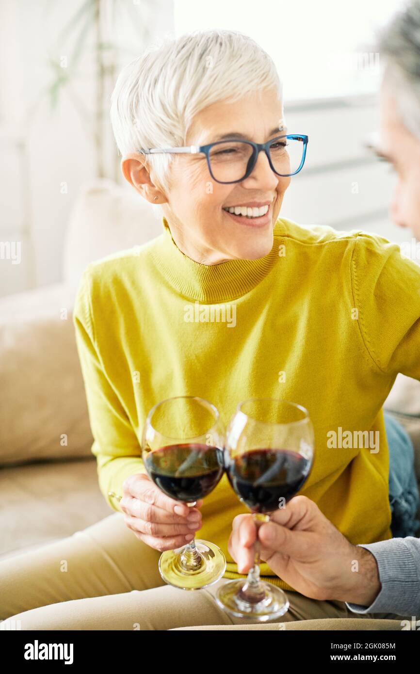 senior woman drinking wine toast happy love glass Stock Photo