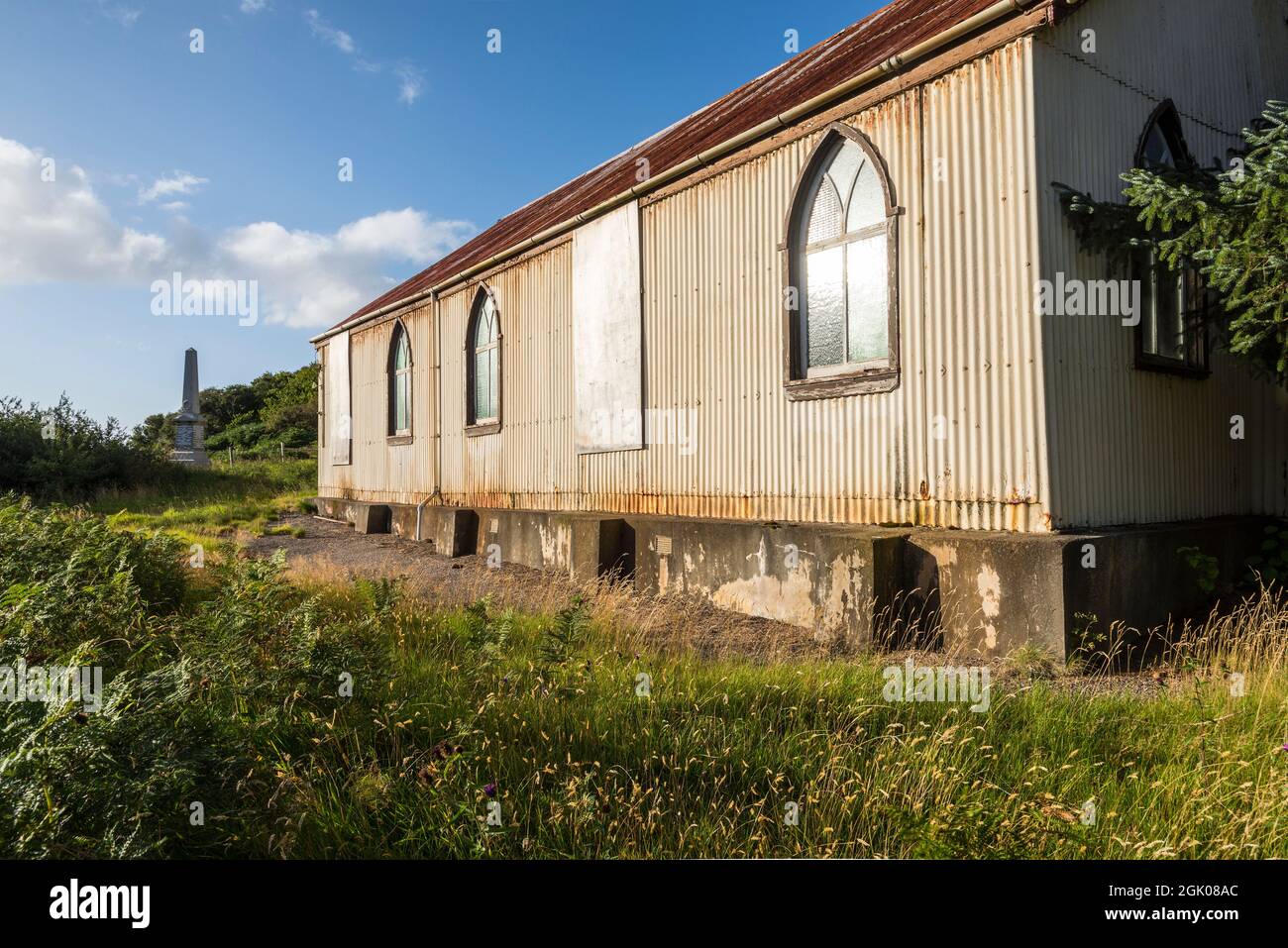 Prefabricated corrugated iron, or tin, church lit by bright evening sunlight at Torrisdale in an area generally referred to as Skerray near the NC500. Stock Photo