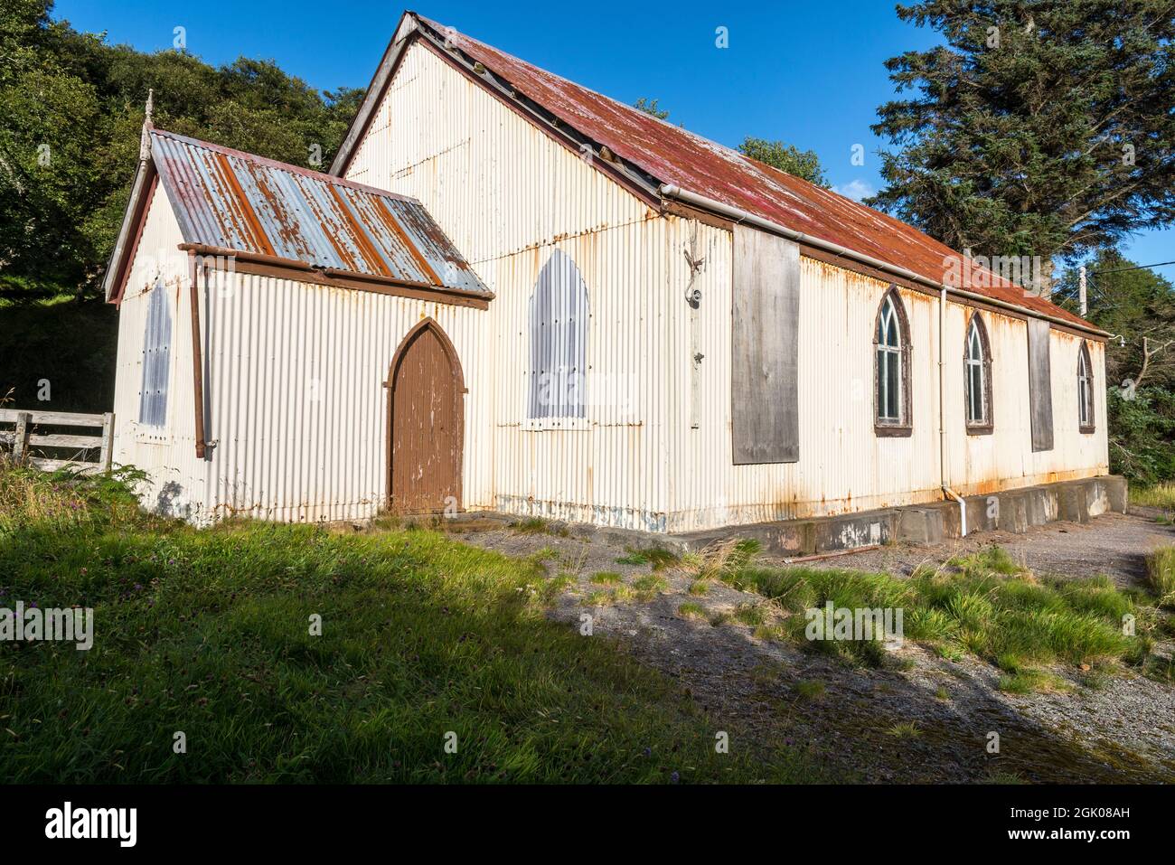 Prefabricated corrugated iron, or tin, church lit by bright evening sunlight at Torrisdale in an area generally referred to as Skerray near the NC500. Stock Photo