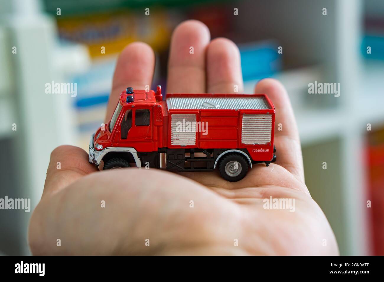 POZNAN, POLAND - Mar 25, 2018: A red model Siku brand toy fire truck on a  open hand Stock Photo - Alamy