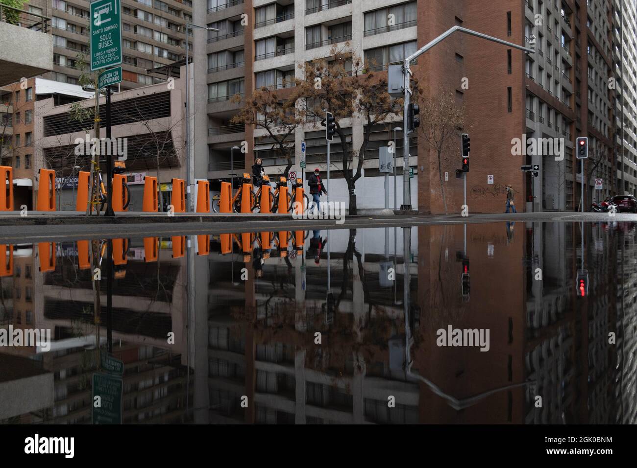 Santiago, Metropolitana, Chile. 12th Sep, 2021. Buildings in downtown Santiago reflected in a pool of water, after a rain at night in Santiago, Chile. (Credit Image: © Matias Basualdo/ZUMA Press Wire) Credit: ZUMA Press, Inc./Alamy Live News Stock Photo