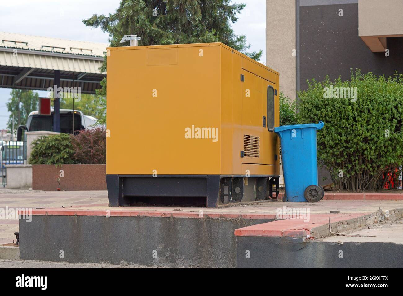 Emergency electric power generator box and garbage bin Stock Photo - Alamy