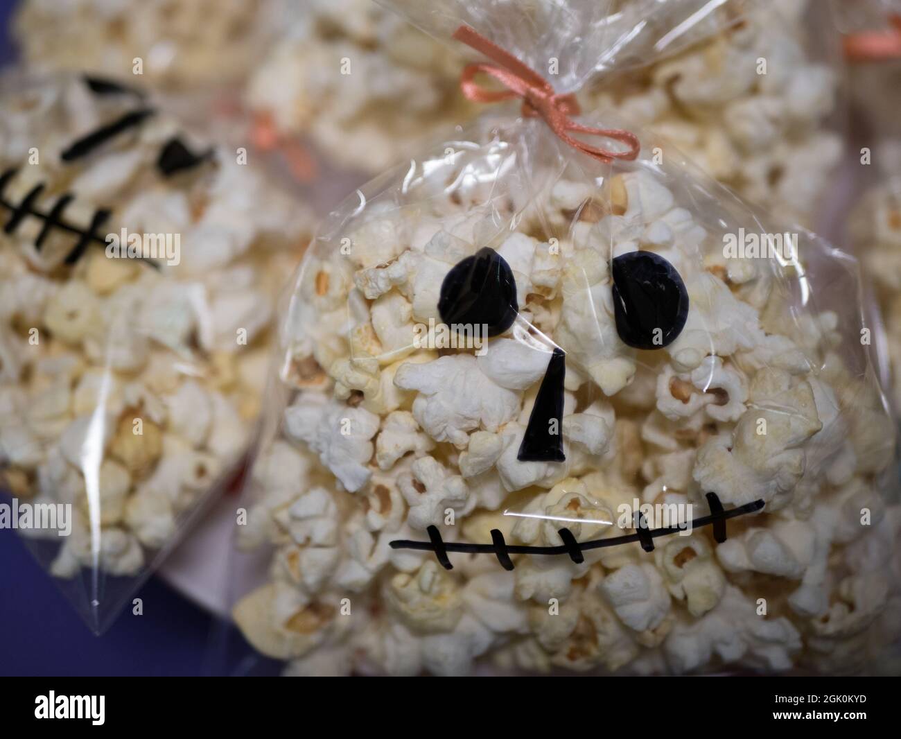 Halloween food, Bag with delicious popcorn in the form of skull Stock Photo
