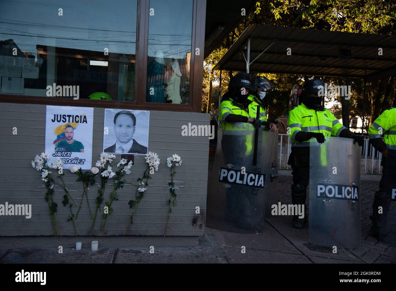 An image of the 13 people who died during protests that reads 'Massacre of September 9, 2020' as police guards the Villa Luz CAI police station were p Stock Photo