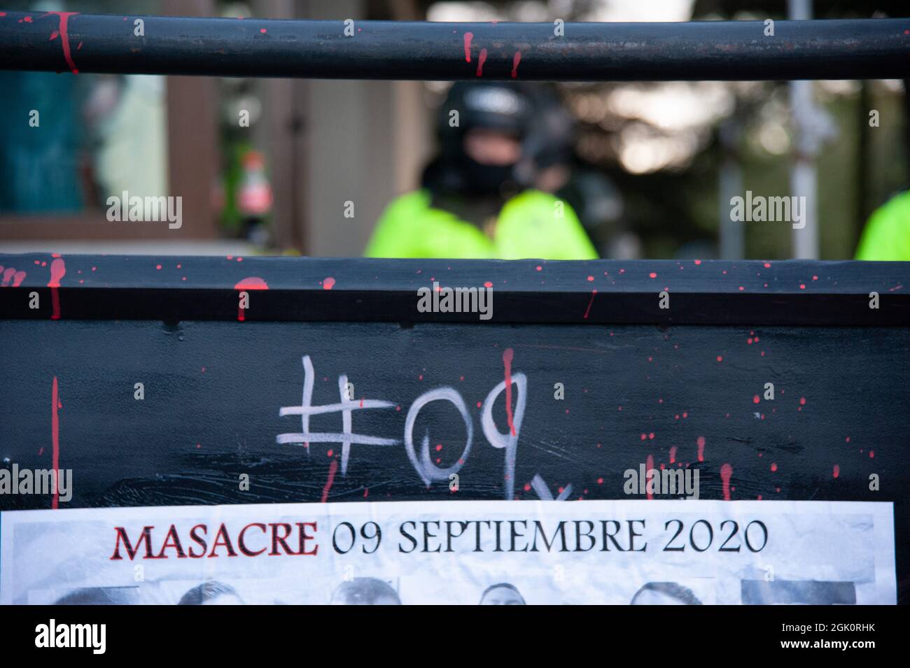 An image of the 13 people who died during protests that reads 'Massacre of September 9, 2020' as police guards the Villa Luz CAI police station were p Stock Photo